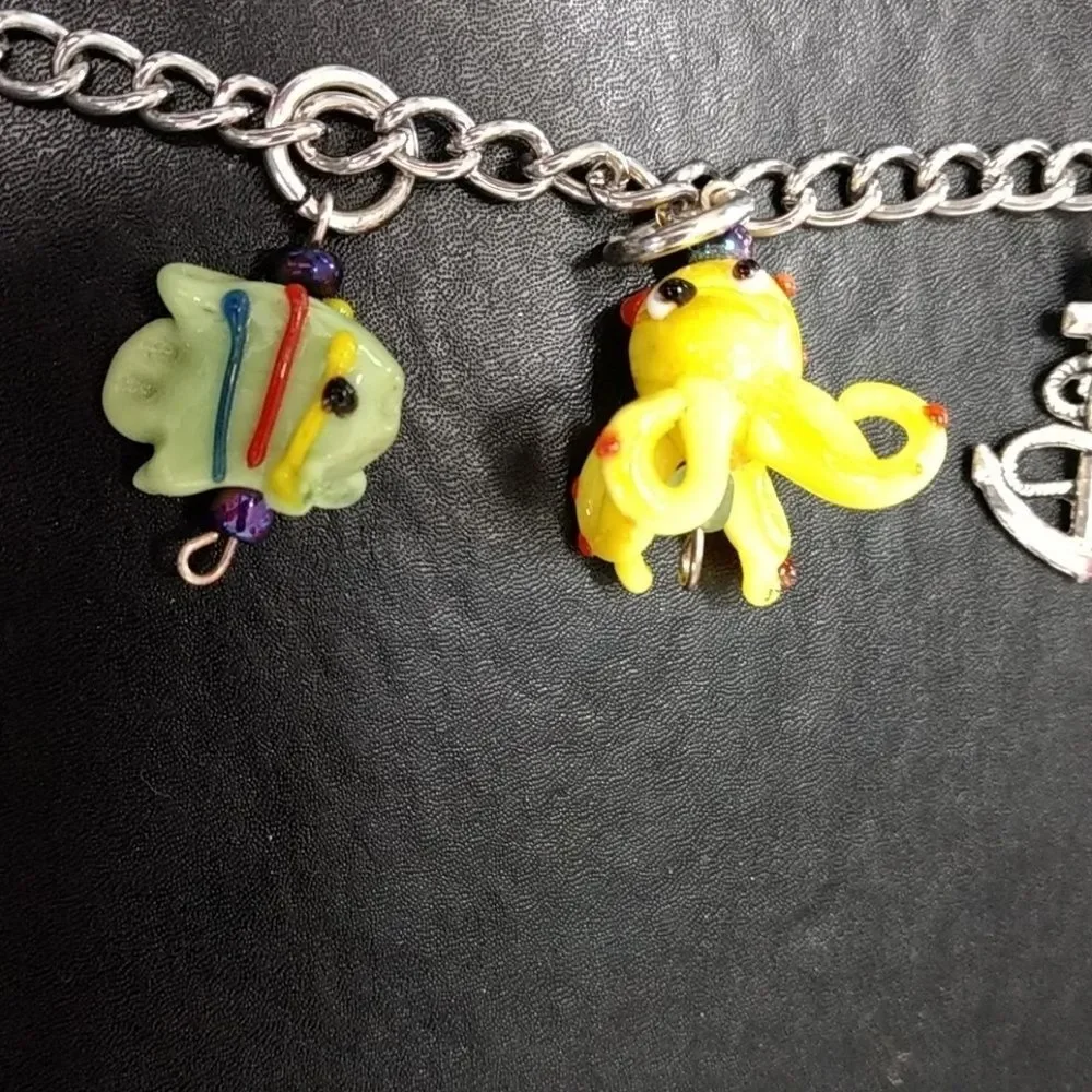 Silver tone Under The Sea charm bracelet up to 9